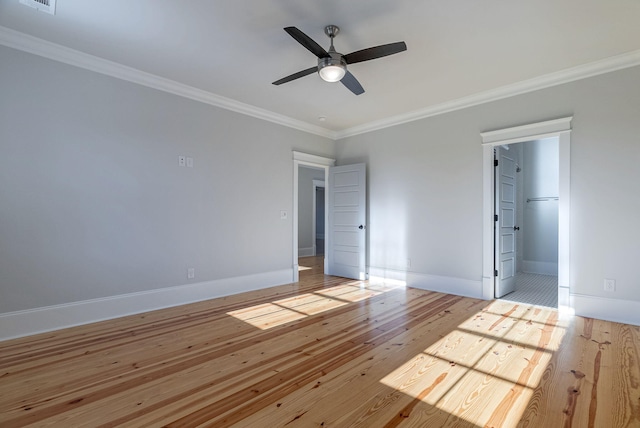 unfurnished bedroom with connected bathroom, light hardwood / wood-style floors, ceiling fan, and crown molding