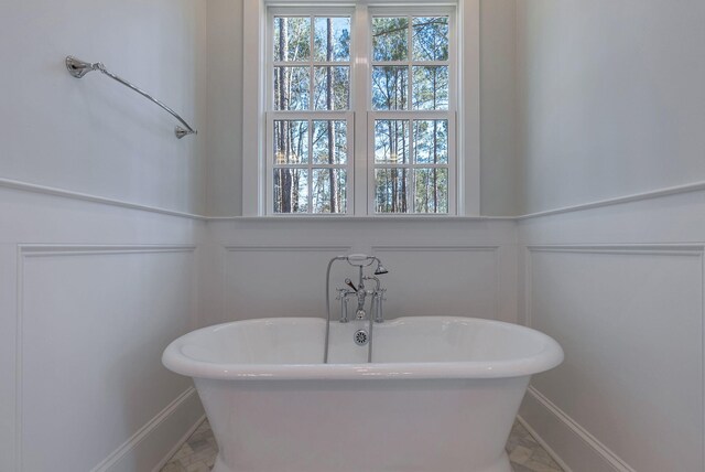 bathroom with a tub