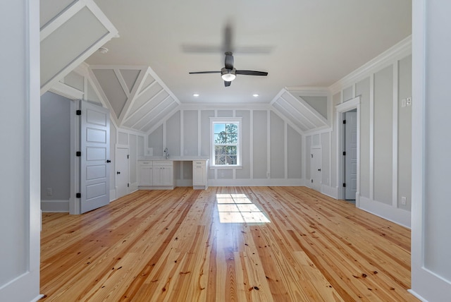 bonus room featuring light wood-type flooring, vaulted ceiling, and ceiling fan