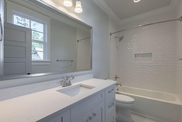 full bathroom with vanity, toilet, crown molding, and tiled shower / bath