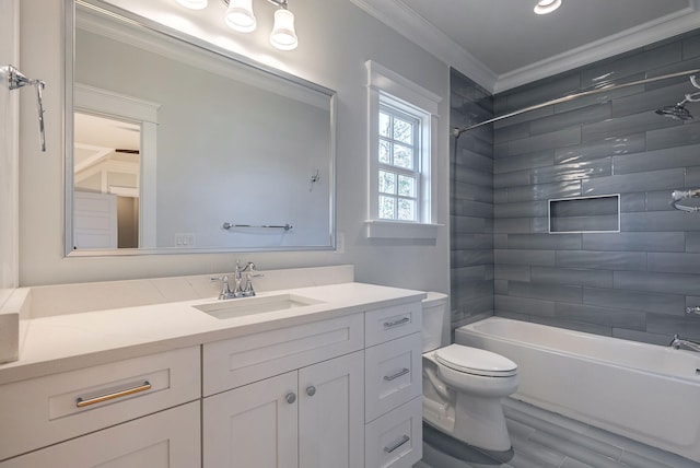 full bathroom with ornamental molding, vanity, hardwood / wood-style floors, toilet, and tiled shower / bath