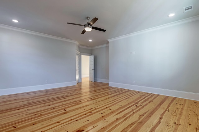 spare room featuring ceiling fan, ornamental molding, and light hardwood / wood-style flooring