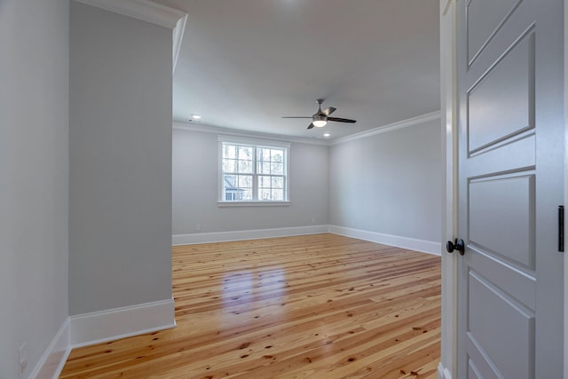 spare room featuring ceiling fan, light hardwood / wood-style floors, and ornamental molding