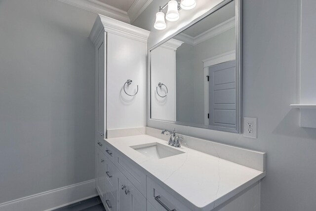 bathroom featuring vanity and ornamental molding