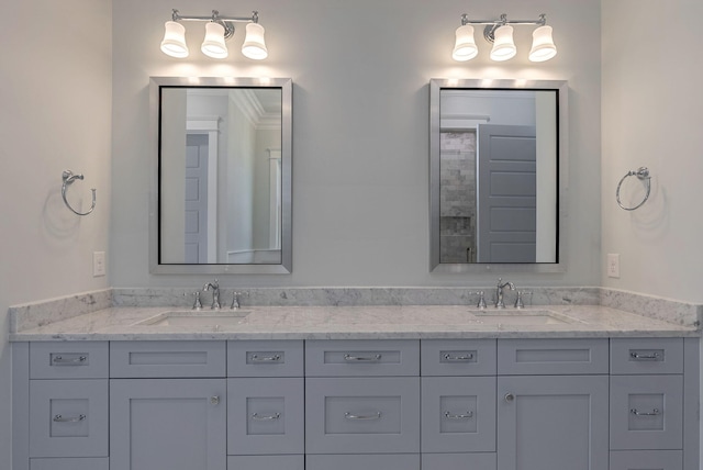 bathroom featuring crown molding and vanity