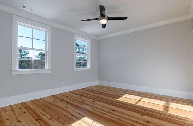 spare room with ceiling fan, light wood-type flooring, and crown molding