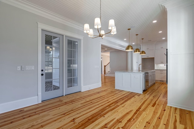 kitchen with dishwasher, a chandelier, light hardwood / wood-style floors, decorative light fixtures, and white cabinets