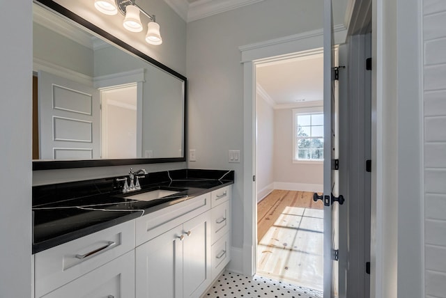 bathroom featuring vanity and ornamental molding