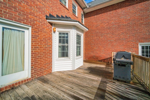 wooden deck with grilling area