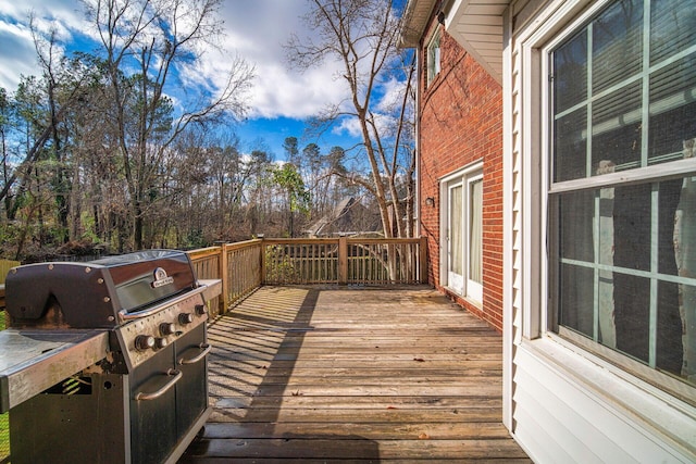 wooden deck featuring grilling area