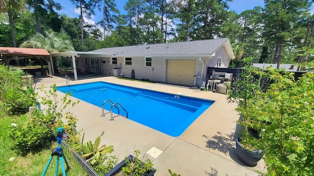 707 Pin Oak Dr, Aiken, SC 29801 - outdoor pool featuring a patio and view of scattered trees