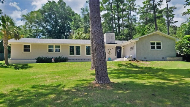 707 Pin Oak Dr, Aiken, SC 29801 - rear view of property featuring a chimney, crawl space, a lawn, brick siding, and view of wooded area