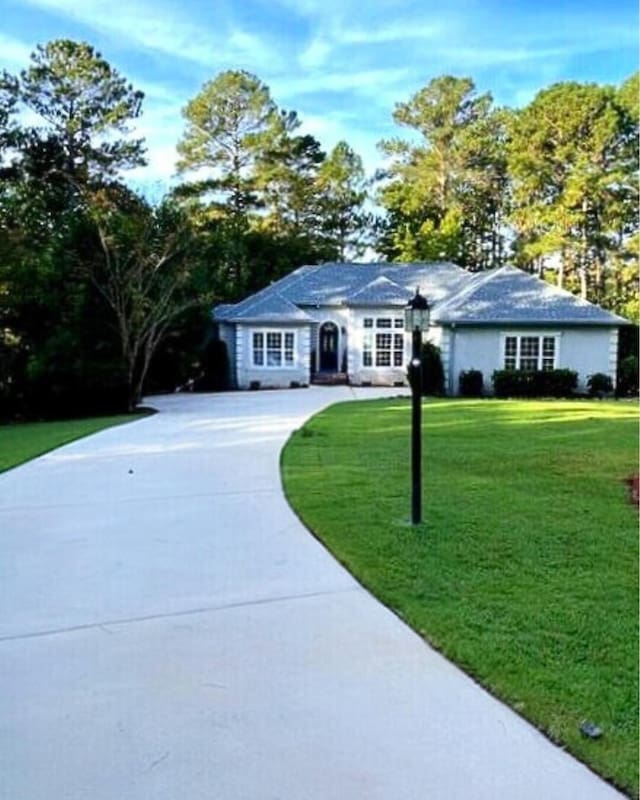 216 Sumter Ln, Mccormick, SC 29835 - ranch-style house with a front lawn and concrete driveway