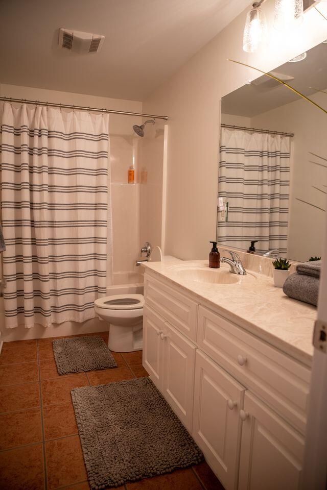 216 Sumter Ln, Mccormick, SC 29835 - full bathroom with vanity, tile patterned flooring, and shower / tub combo with curtain