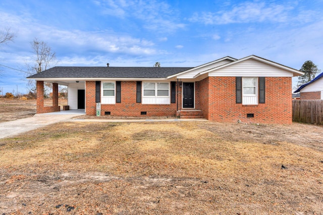 ranch-style home with a carport and a front lawn