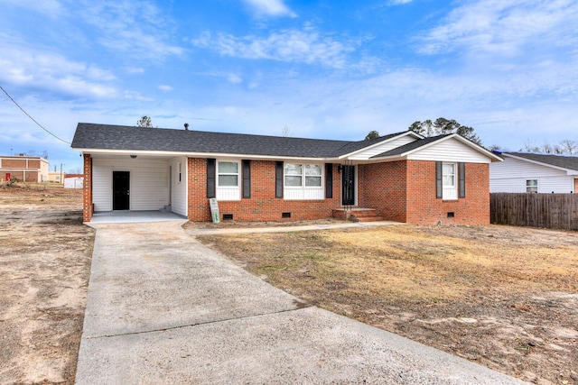 ranch-style house with a carport