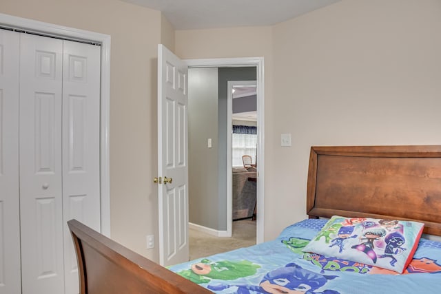 4538 Country Glen Cir, Grovetown, GA 30813 - bedroom featuring light colored carpet, baseboards, and a closet