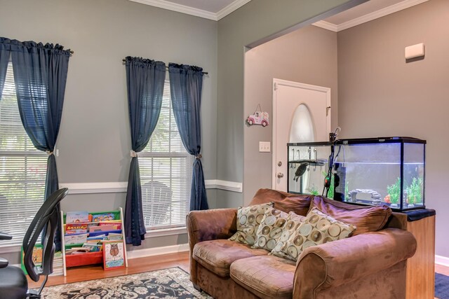 4538 Country Glen Cir, Grovetown, GA 30813 - living area with wood finished floors, baseboards, crown molding, and healthy amount of natural light