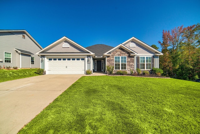 view of front facade with a front yard and a garage