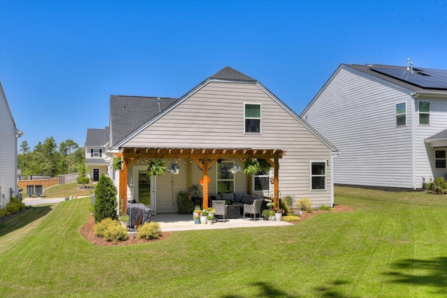 rear view of house with a lawn, a pergola, a patio area, and outdoor lounge area