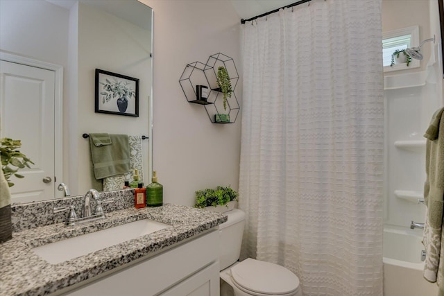 full bath with toilet, shower / bath combo, and vanity