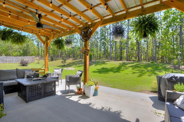 view of patio with outdoor lounge area, fence, ceiling fan, and area for grilling