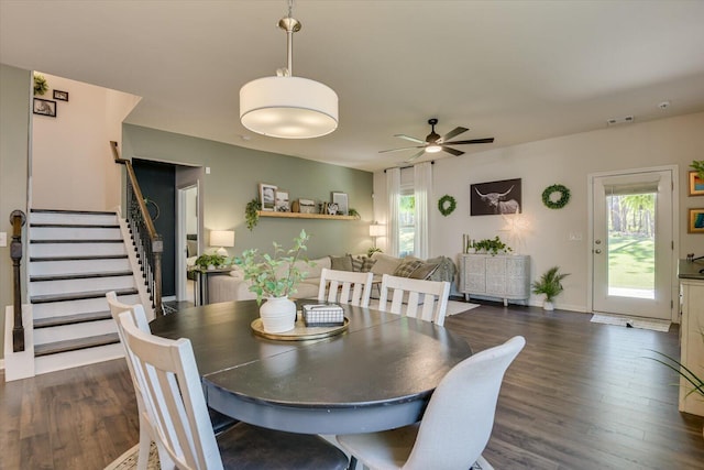 dining space featuring dark wood-style floors, ceiling fan, and plenty of natural light