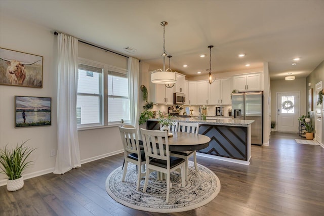 dining space with dark wood-style flooring, visible vents, recessed lighting, and baseboards