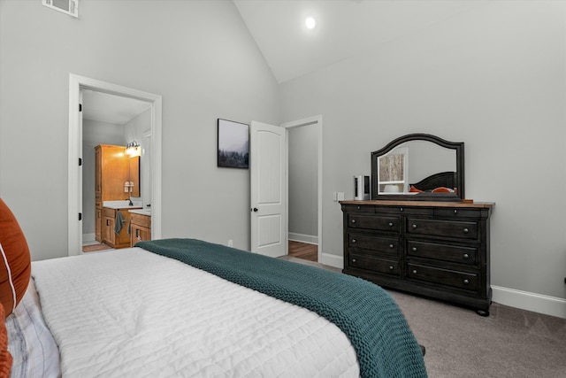 carpeted bedroom featuring high vaulted ceiling