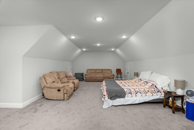 bedroom featuring lofted ceiling and light colored carpet