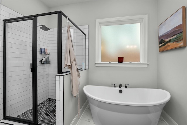 bathroom with separate shower and tub