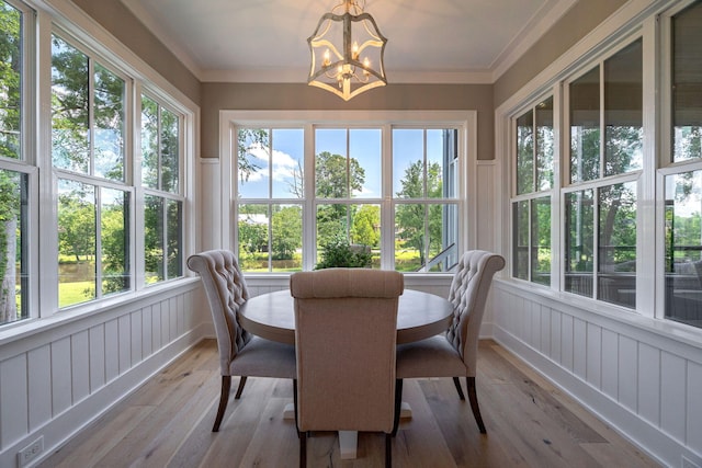 188 Lagoon Dr, Clarks Hill, SC 29821 - sunroom / solarium with a decorative wall, hardwood / wood-style floors, a chandelier, a wainscoted wall, and healthy amount of natural light