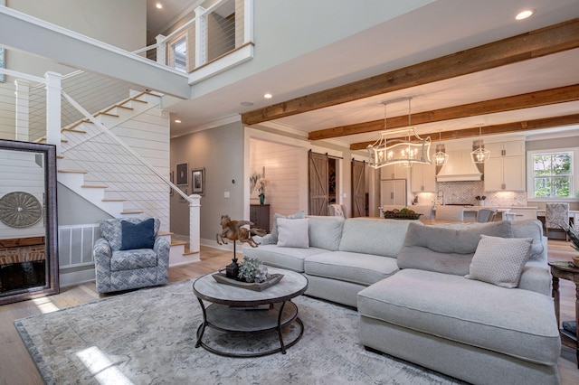 188 Lagoon Dr, Clarks Hill, SC 29821 - living room featuring stairway, light wood-style floors, beamed ceiling, recessed lighting, and a fireplace