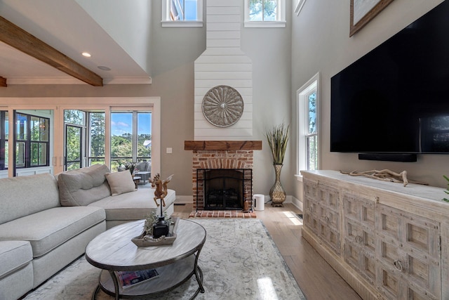 188 Lagoon Dr, Clarks Hill, SC 29821 - living room featuring healthy amount of natural light, light wood finished floors, a high ceiling, a fireplace, and recessed lighting