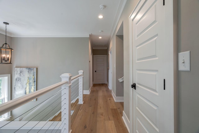 188 Lagoon Dr, Clarks Hill, SC 29821 - hallway featuring an upstairs landing, crown molding, light wood-type flooring, a chandelier, and recessed lighting