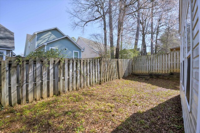 view of yard featuring a fenced backyard