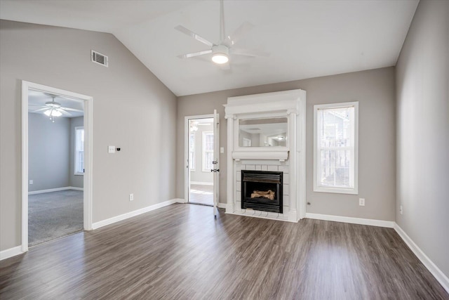 unfurnished living room with visible vents, a healthy amount of sunlight, and a fireplace