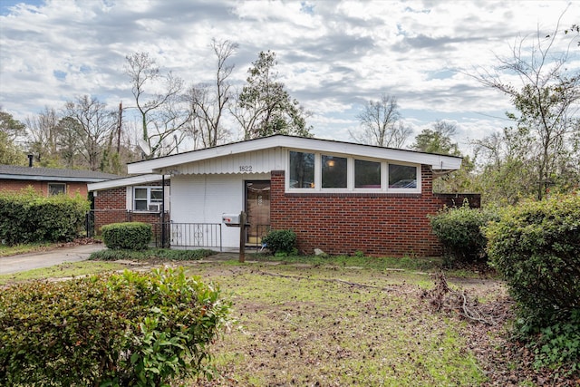 view of side of property with brick siding