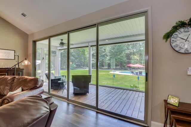 1370 Deerwood Cir, Stapleton, GA 30823 - doorway to outside featuring wood finished floors, lofted ceiling, and healthy amount of natural light