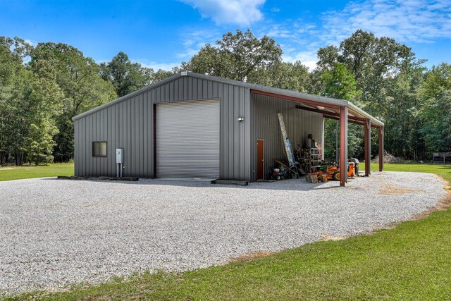 garage featuring a yard