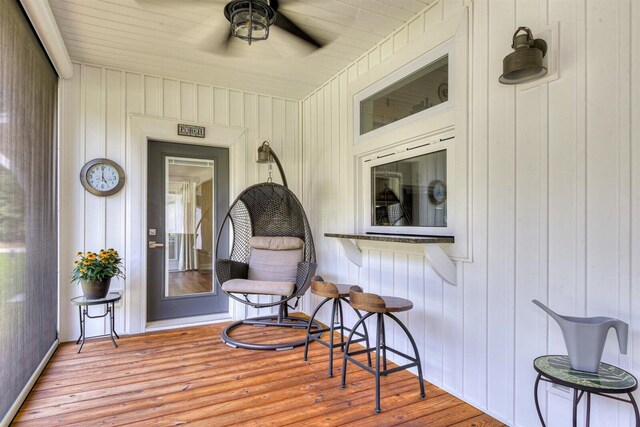 wooden deck featuring ceiling fan