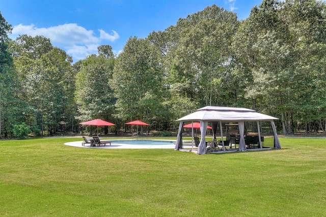 1370 Deerwood Cir, Stapleton, GA 30823 - swimming pool featuring a gazebo, a lawn, a patio, and view of scattered trees