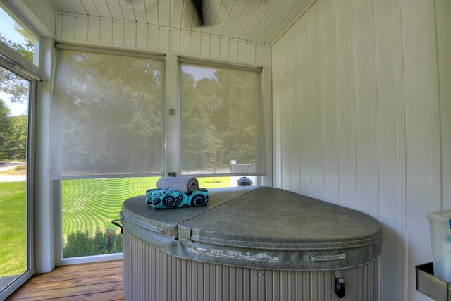 unfurnished sunroom with a jacuzzi