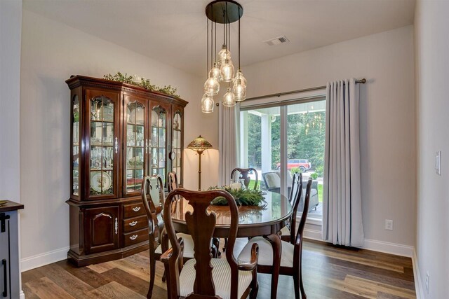 dining space featuring dark hardwood / wood-style floors