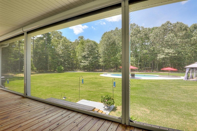 1370 Deerwood Cir, Stapleton, GA 30823 - unfurnished sunroom with view of scattered trees
