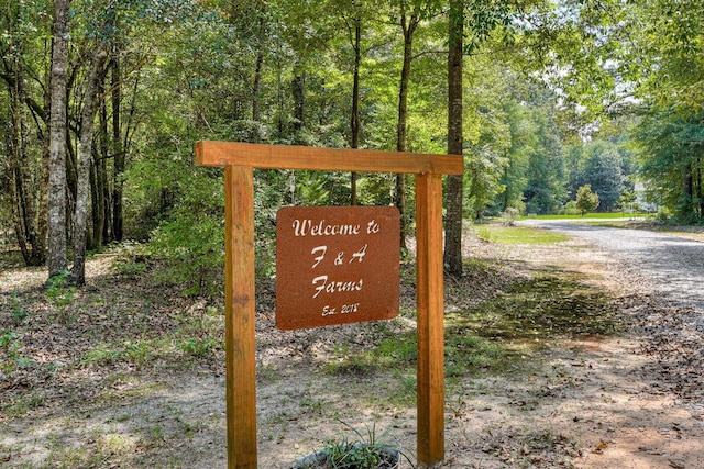 1370 Deerwood Cir, Stapleton, GA 30823 - community sign featuring a wooded view
