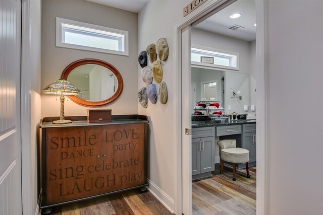 bathroom with vanity and hardwood / wood-style flooring