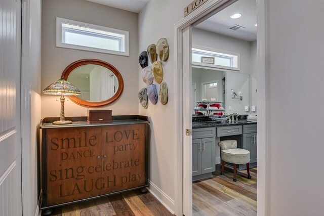 1370 Deerwood Cir, Stapleton, GA 30823 - hallway with wood finished floors and a sink