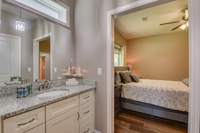 1370 Deerwood Cir, Stapleton, GA 30823 - bedroom featuring a sink and dark wood-style floors