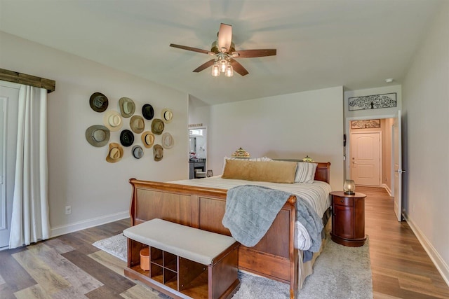 1370 Deerwood Cir, Stapleton, GA 30823 - bedroom with wood finished floors and a ceiling fan